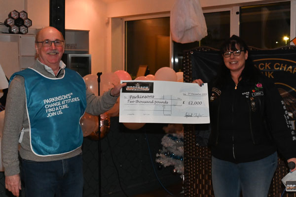 Steve Heron, our Treasurer, receiving a cheque for £2,000 on 2 December 2021 raised by the 'Hogs Back Chapter of Harley Davidson enthusiasts' to support the branch.